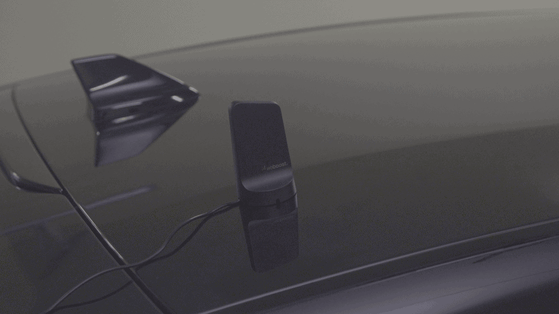 weboost cell phone booster antenna on roof of vehicle
