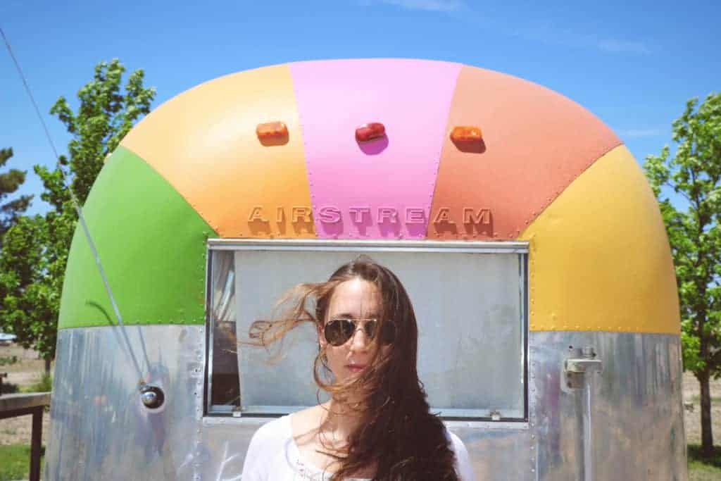 image of woman in front of airstream dot